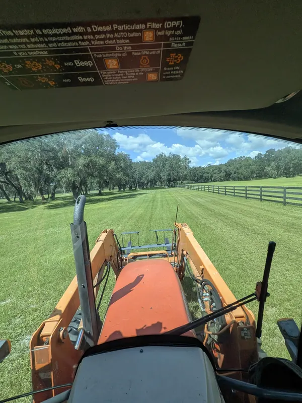 Fresh-cut pasture with fence lines trimmed